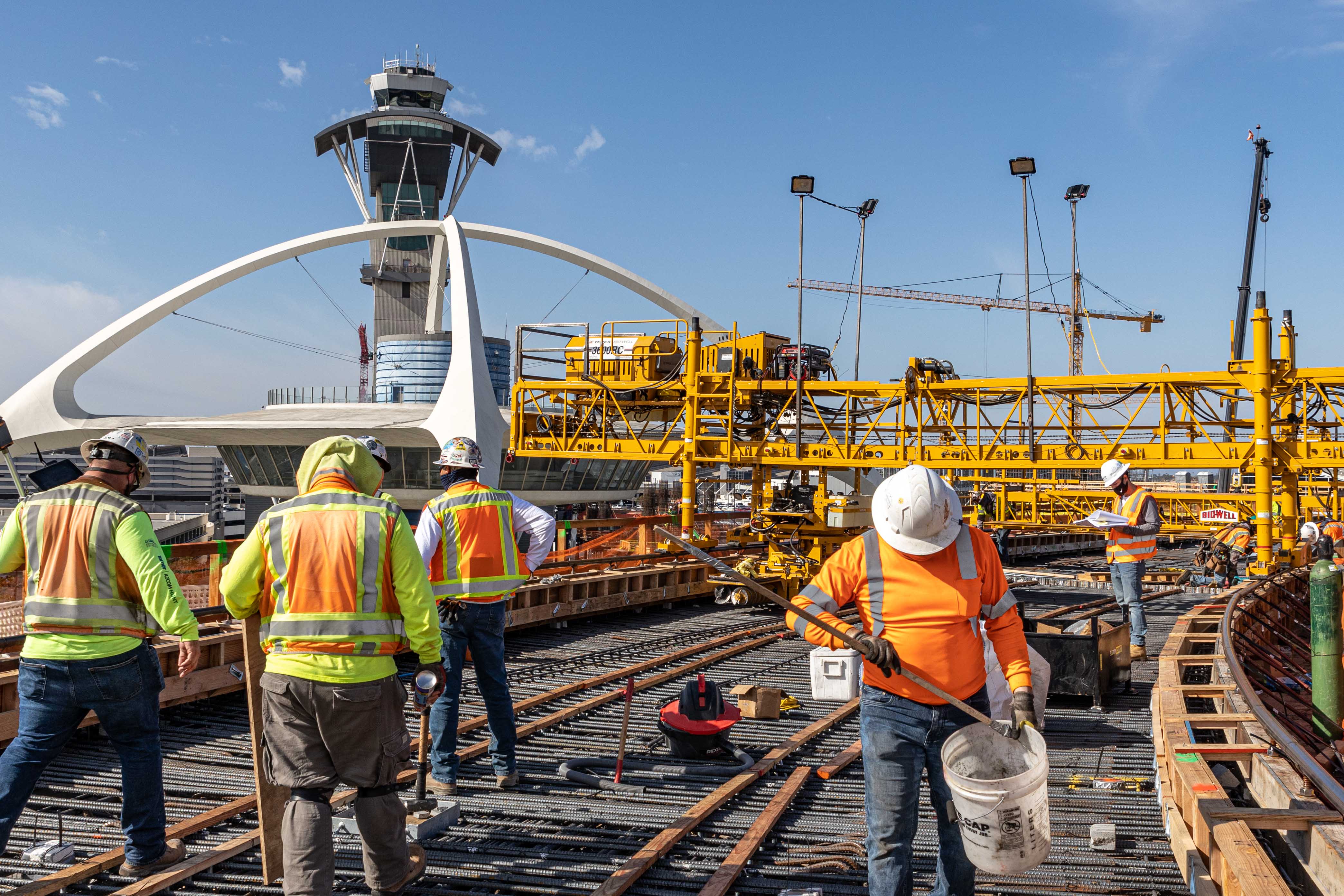 Crews prepare for the final concrete pour for the future East CTA station. This will complete construction of the guideway superstructure so that station construction can begin.