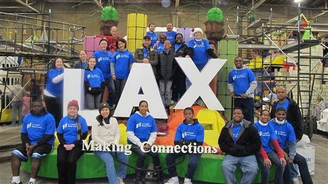 Photo of the volunteers sitting on LAX parade float.