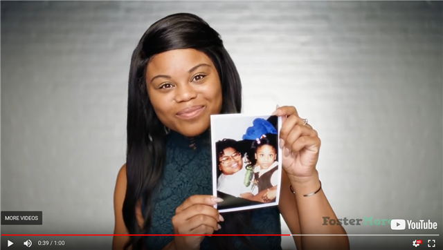 Teenage girl showing her baby picture