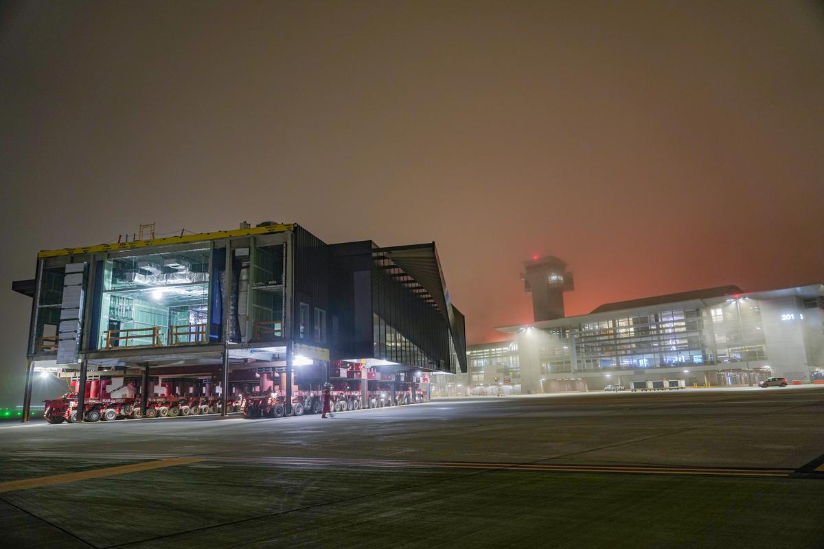 A building segment of the Midfield Satellite Concourse South project during its move across an airfield at Los Angeles International Airport (LAX).