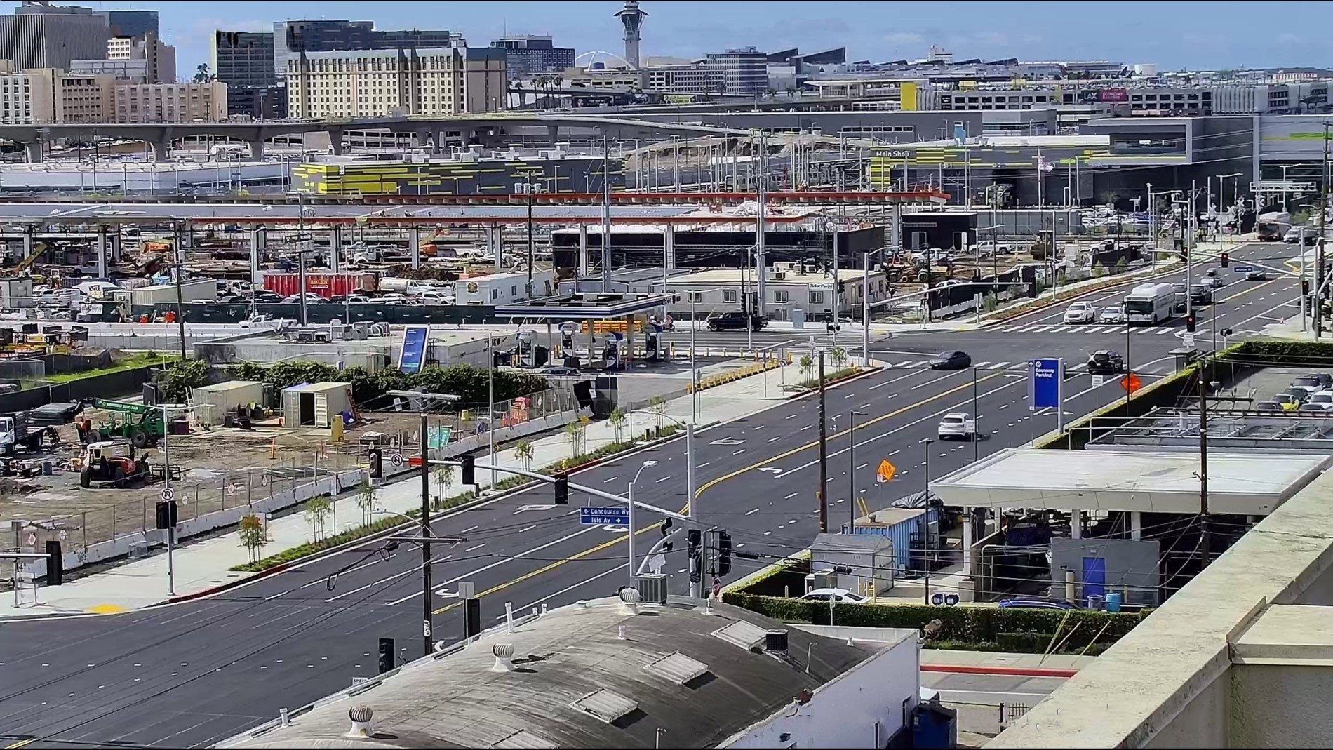 View looking west on Arbor Vitae Street showing street widening alongside the northern and western edges of Consolidated Rent-A-Car facility property.